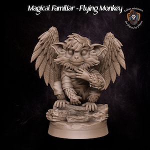 May include: A miniature figurine of a flying monkey with brown fur, wings, and a mischievous expression. The monkey is perched on a rock base. The figurine is painted in a brown color scheme.