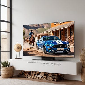 May include: A blue sports car with a white stripe drives down a dusty road in front of a rustic building. The car is displayed on a black frame TV with the text "PREMIUM FRAME TV ART | 4K QUALITY" below it.