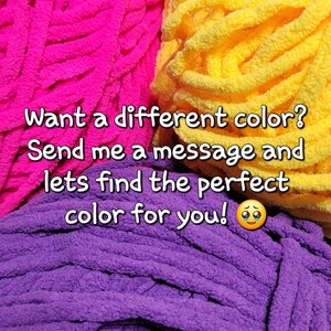 May include: Three skeins of yarn in different colors: pink, yellow, and purple. The text on the image reads: "Want a different color? Send me a message and let's find the perfect color for you!"