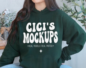 May include: A dark green hooded sweatshirt with the text "CICI'S MOCKUPS" in white, with the tagline "REAL MODELS | REAL PHOTOS" below.