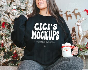May include: A black sweatshirt with the text "CICI'S MOCKUPS" in white, retro-style lettering. The text "REAL MODELS | REAL PHOTOS" is also in white below the main text.