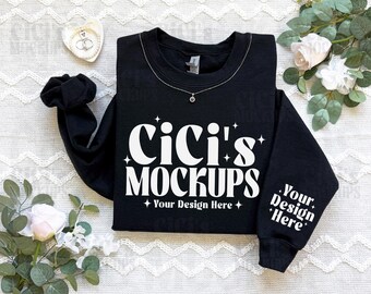 May include: Black sweatshirt mockup with the text "Cici's Mockups" and "Your Design Here" in white. The sweatshirt has long sleeves and a crew neck.