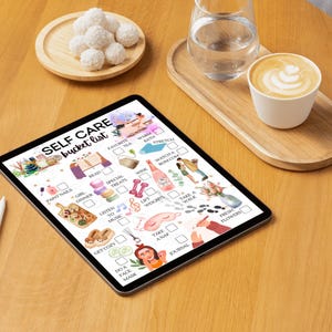 May include: A digital tablet displaying a self-care bucket list with illustrations of various activities, including reading, taking a bath, listening to music, and getting a manicure. The list is on a wooden table with a cup of coffee and a glass of water.