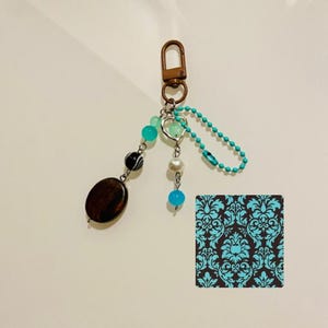 2000s teal and brown keychain