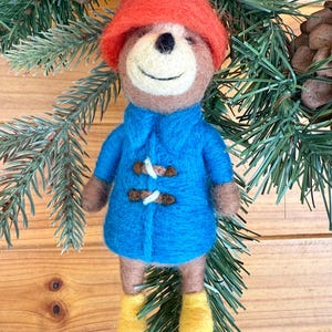 Needle felted Paddington Bear Christmas ornament. Handmade wool felt bear and red hat, classic storybook character Holiday tree decoration.