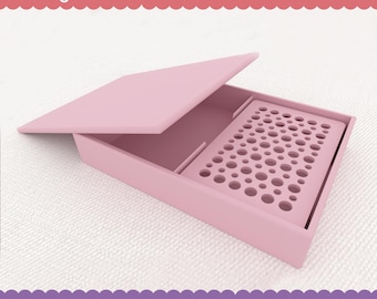 May include: A pink plastic storage box with a lid, designed for storing polymer clay tools. The box has a removable tray with a grid of small holes.