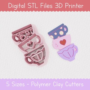 Peut inclure: Fichiers STL numériques pour l'impression 3D de cinq tailles de découpeurs en pâte polymère en forme de tasses à thé empilées. Les découpeurs sont roses et violets.