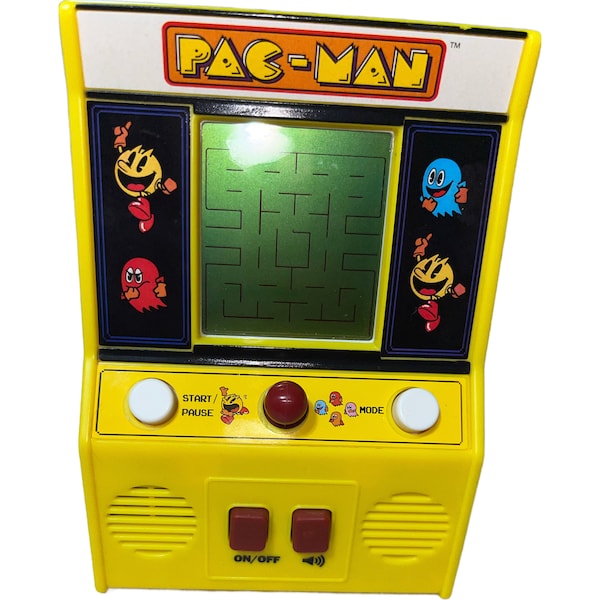 Retro handheld PAC-MAN game. Includes 2 AA batteries. Very good condition. Made by Bandai. Has 2 play modes- eat the dots and chase.