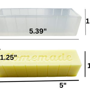 May include: A clear, rectangular soap mould, 13.69 cm long and 4.17 cm high, sits above a yellow soap bar. The bar is 12.7 cm long, 3.18 cm high, and has "homemade" embossed on top. Soap making supplies.