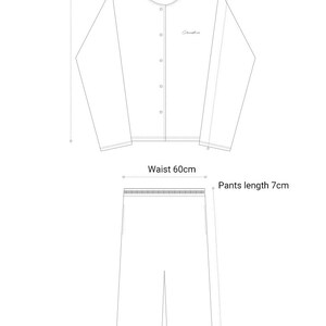 May include: A line drawing of a pajama set with measurements in centimeters. The top has a button-up front and long sleeves. The pants have a waistband and a straight leg.