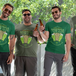 Sipping Guinness, Pondering Galaxies. Happy St. Patrick's day. The Perfect Unisex T-Shirt for the Irish Astrophysics Lover.