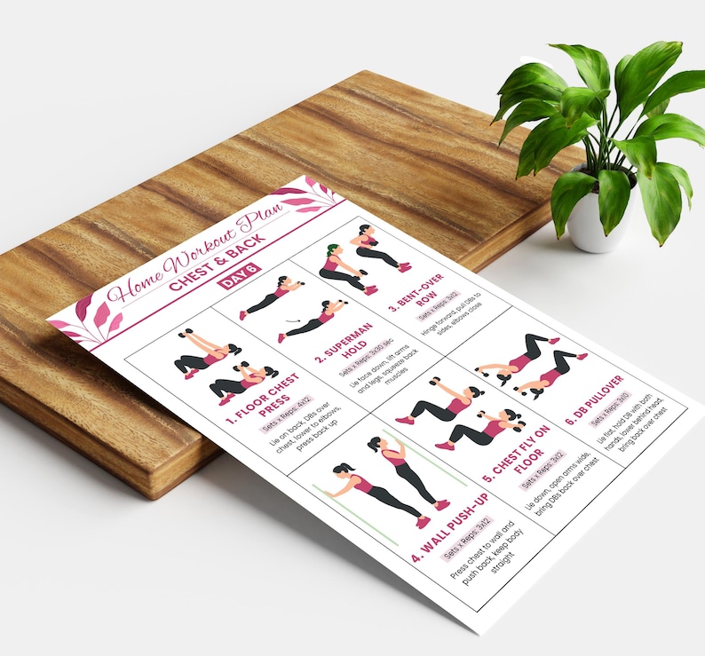 May include: A white workout plan titled "Home Workout Plan Chest & Back Day 6" with illustrated exercise instructions. The plan is on a wooden cutting board with a potted plant.