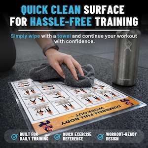 May include: A clear plastic workout guide with a dumbbell full body workout printed on it. The guide is being wiped with a gray towel. The text on the guide says "Quick Clean Surface For Hassle-Free Training". A Hydro Flask water bottle is in the background.