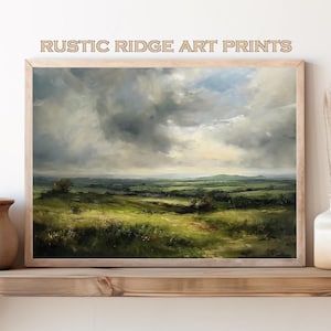 May include: A framed landscape painting depicting a rolling green field with a cloudy sky. The painting is in a light wood frame and is hanging on a wooden shelf.