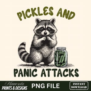 May include: A black and white illustration of a raccoon with a jar of pickles. The text above reads "PICKLES AND" and below reads "PANIC ATTACKS". The image also includes the text "Minnesota PRINTS & DESIGNS" and "PNG FILE".