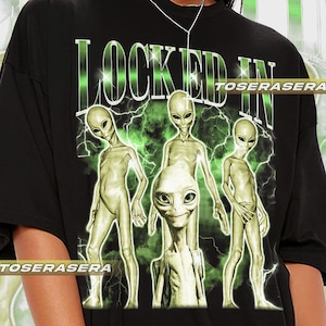 Alien Locked In Unisex Softstyle T-Shirt, UFO Extraterrestrial Graphic Tee, Space Lover Alien Apparel, Sci-Fi Galaxy Astronaut Shirt, Funny