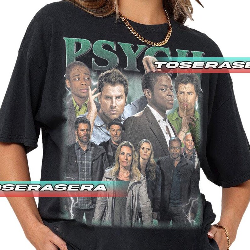 May include: A black short-sleeve t-shirt featuring a large graphic print of the cast from the television show Psych. The design includes multiple characters in various poses with the word PSYCH printed in large green letters at the top.