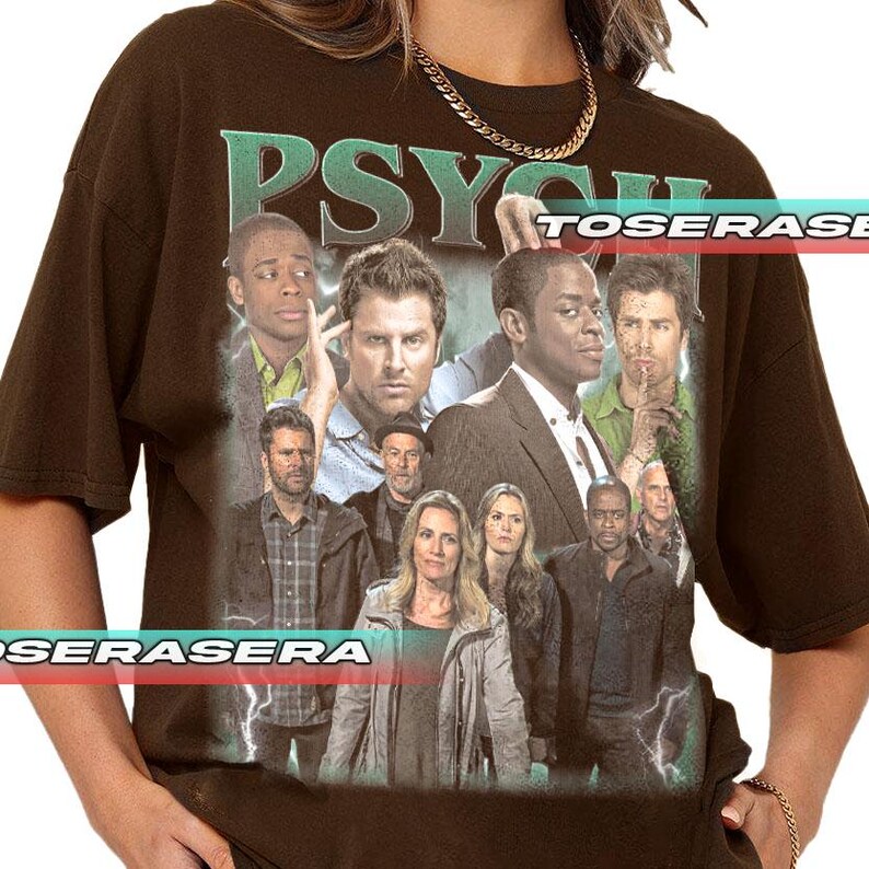 May include: A dark brown short-sleeve t-shirt featuring a large graphic print of the cast of the television show Psych. The text PSYCH is printed in large green letters at the top. The graphic includes multiple characters in various poses.