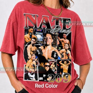 May include: A red short-sleeve t-shirt featuring a large graphic print of Nate Diaz. The design includes multiple images of the fighter in action, the text NATE DIAZ, and the number 209. The shirt has a vintage-style wash and a crew neckline.