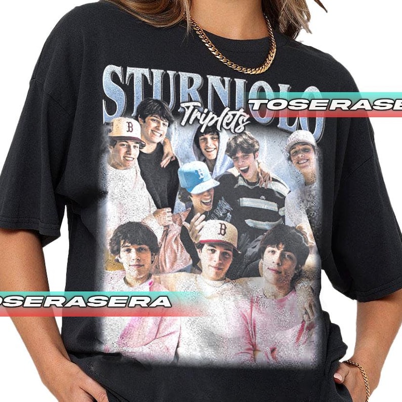 May include: Black t-shirt featuring a group photo of young men with the text "STURNIOLO Triplets" in a stylized font. The image includes several individuals wearing baseball caps and casual attire. The shirt has a vintage, slightly faded appearance.