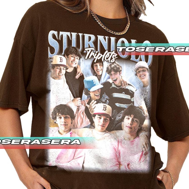 May include: Brown t-shirt featuring a graphic of a group of young men with the text "STURNIOLO Triplets" in a vintage style. The graphic includes images of the individuals wearing hats and smiling. The shirt has a relaxed fit.