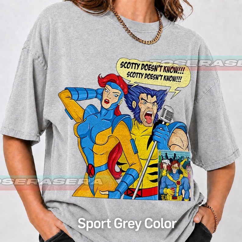 May include: A grey t-shirt featuring a graphic of X-Men characters Jean Grey and Wolverine. Wolverine holds a microphone and sings, with a speech bubble above reading, "SCOTTY DOESN'T KNOW!!! SCOTTY DOESN'T KNOW!!!" A small comic panel is included below.