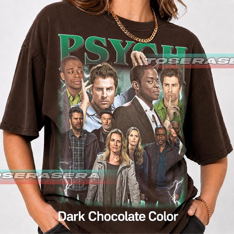 May include: A dark chocolate brown short-sleeve t-shirt featuring a large graphic print of the Psych television show cast. The word PSYCH is printed in large green letters at the top. The design includes multiple characters and lightning effects.