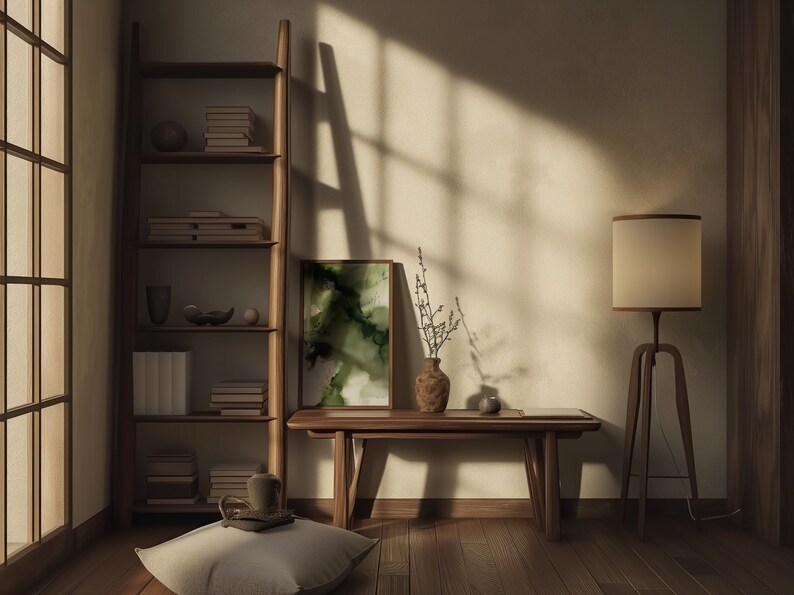May include: A wooden bench with a vase of dried branches and a framed abstract painting with green and white colors. The bench is in a room with a wooden floor and a bookshelf with books and decorative objects.