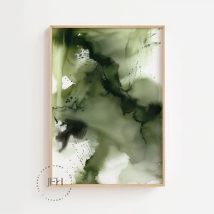 May include: Abstract art print with green and black watercolor paint in a wooden frame.