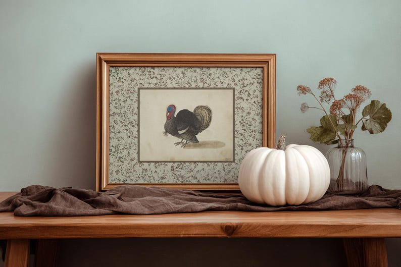 Vintage illustration of a turkey with detailed feathers, surrounded by a neutral floral border, rustic Thanksgiving wall art mailed print for farmhouse and autumn decor.