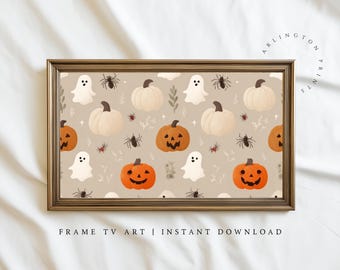 May include: A rectangular framed digital print featuring a repeating pattern of white ghosts, orange jack-o'-lanterns, cream-colored pumpkins, and black spiders on a light beige background. The frame is metallic gold with a classic molding design.