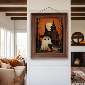 Vintage-style Halloween wall art featuring a cute ghost in a witch hat, a black cat with a glowing pumpkin, and a haunted house under a full moon. Perfect printable art for spooky and gothic Halloween decor.