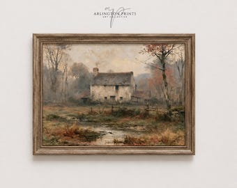 May include: A landscape painting in a brown wooden frame depicting a stone cottage in a field with a small stream in the foreground. The scene features muted earth tones, bare trees, and a cloudy sky. The text Arlington Prints Art Collective is visible.