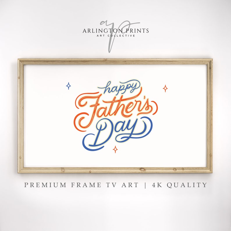 May include: A framed art print with the words "Happy Father's Day" in orange and blue script on a white background. The print is in a light brown wooden frame. The text "PREMIUM FRAME TV ART | 4K QUALITY" is at the bottom.