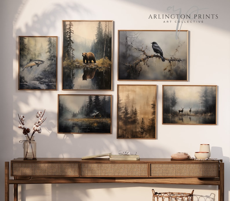 ustic wilderness-themed gallery wall featuring digital paintings of a bear by a lake, a crow on a branch, deer in misty woods, a cabin by the water, a leaping fish, and a foggy forest. Earthy tones and moody lighting create a serene, nature-inspired aesthetic perfect for lodge, cabin, or modern rustic decor.