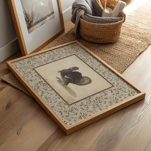 Vintage illustration of a turkey with detailed feathers, surrounded by a neutral floral border, rustic Thanksgiving wall art mailed print for farmhouse and autumn decor.