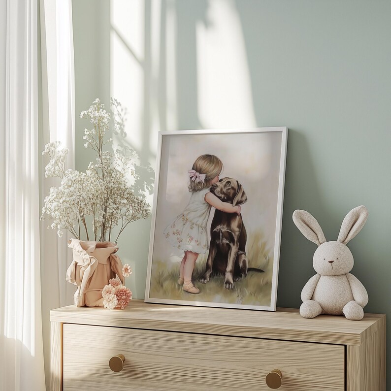 Digital printable artwork of a little girl with a pink bow hugging a chocolate labrador dog. Soft, painterly texture with pastel tones, delicate grass beneath them, and floral detail on the girl's dress. This heartwarming image evokes gentle childhood and pet-loving affection, styled for feminine, coquette, or vintage-inspired girls' nursery decor. Available in 5 aspect ratios as high-resolution JPEGs for instant download and printing.