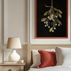 Printable mistletoe wall art with green leaves and white berries on a dark background, vintage rustic Christmas holiday print