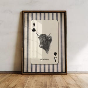 Downloadable western wall art featuring a black bull head inside an Ace of Spades playing card with “Made in the U.S.A.” text, styled with vintage country charm.