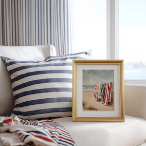 Beach scene with red, white, and blue towels hanging on a wooden fence, ocean waves and swimmers in the background. Coastal Americana style perfect for summer or 4th of July decor. Patriotic Beachy Wall Art, Coastal 4th of July PRINTABLE, Red White Blue Beach Towels, Vintage Summer Seaside Decor, Retro Americana Print