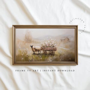 May include: A framed landscape painting depicts a sheep pulling a wooden cart filled with flowers. The artwork has a soft, muted color palette with a farmhouse aesthetic. The text "FRAME TV ART | INSTANT DOWNLOAD" is at the bottom.