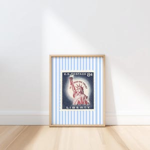 Vintage U.S. postage stamp wall art featuring the Statue of Liberty with patriotic colors and retro background, perfect for 4th of July or Americana decor.