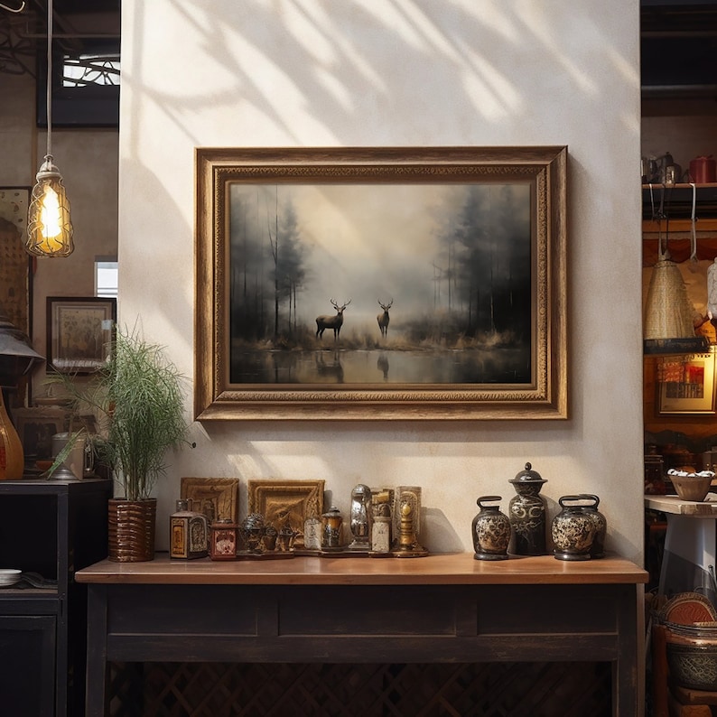 ustic wilderness-themed gallery wall featuring digital paintings of a bear by a lake, a crow on a branch, deer in misty woods, a cabin by the water, a leaping fish, and a foggy forest. Earthy tones and moody lighting create a serene, nature-inspired aesthetic perfect for lodge, cabin, or modern rustic decor.