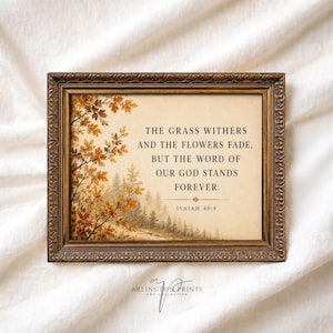 May include: A rectangular wall art piece in an ornate bronze-toned frame featuring a beige background with autumn-colored foliage on the left and a forest silhouette. The text reads: The grass withers and the flowers fade, but the word of our God stands forever. Isaiah 40:8.