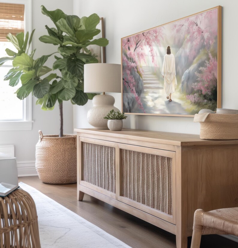 Frame TV art featuring Jesus Christ resurrected, walking up a path surrounded by glowing cherry blossom trees, in a soft pastel spring setting. Spiritual and serene Christian artwork designed for Samsung Frame TV, ideal for Easter and springtime décor.