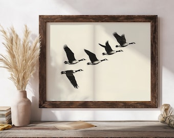 May include: A framed print of a black and white illustration of five geese flying in formation against a white background.