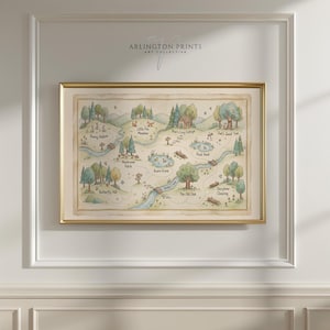 May include: A framed watercolor map print with a gold frame. The map features a whimsical forest scene with labeled locations like "Bunny Hollow" and "Bear's Cozy Cottage." The text "ARLINGTON PRINTS ART COLLECTIVE" is at the top.