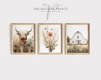 May include: Set of three framed watercolor prints. The prints feature a Highland cow, a floral arrangement, and a white barn. The frames are a light wood color. The prints are in a farmhouse style.