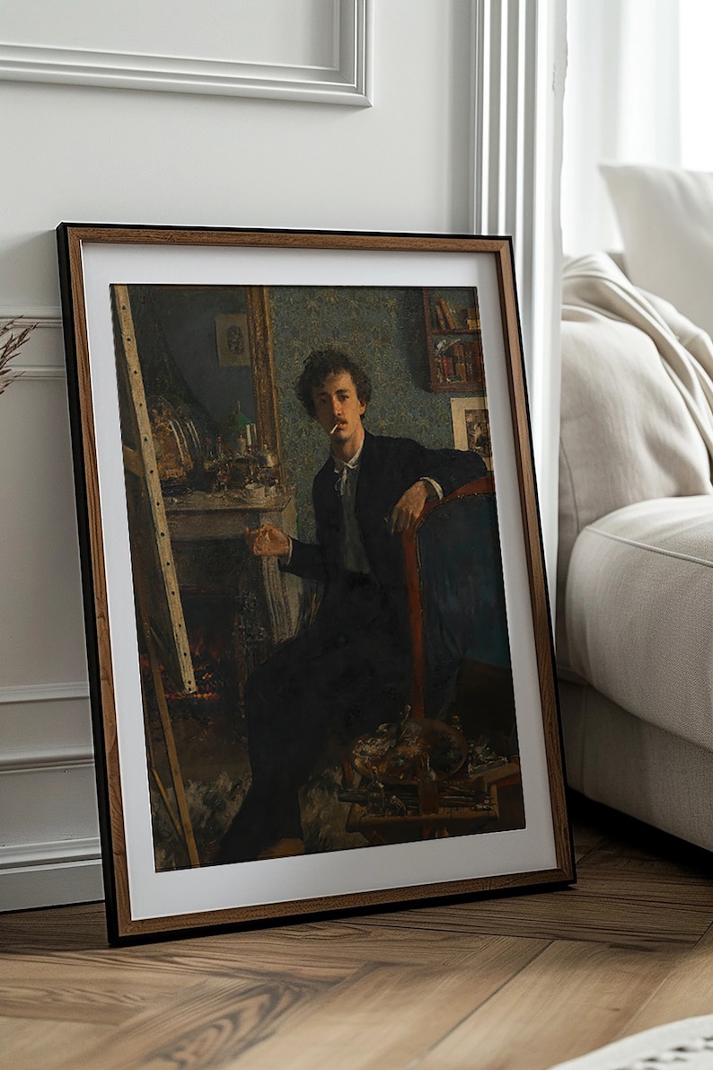 May include: A framed painting of a man in a dark suit sitting in a chair, holding a cigarette. The painting is set in a room with a fireplace and an easel in the background.