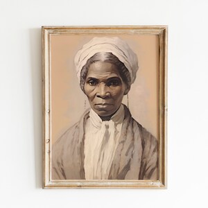 May include: A framed portrait of a woman with dark skin, wearing a white head covering and a light-colored garment. The artwork has a vintage aesthetic, with a soft color palette of beige, gray, and white. The frame is a distressed gold color.